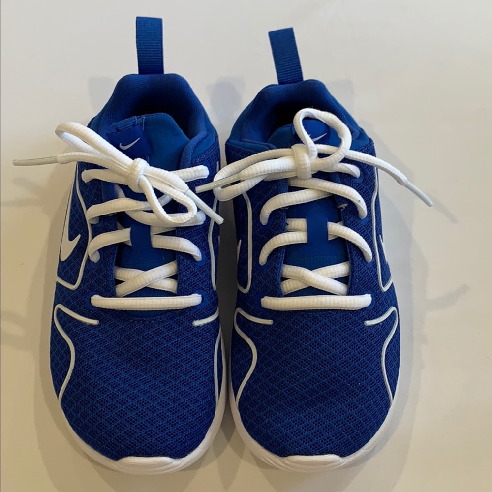 New. Blue Nikes, white laces, sole, and symbol.